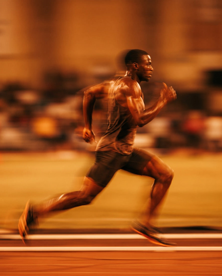 A sprinter mid-stride, captured with motion blur